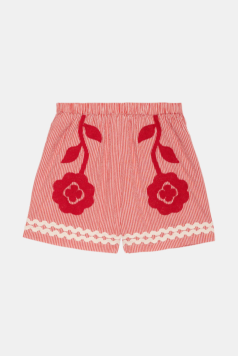 Luźne szorty o swobodnym kroju Abelone Red Flower marki SISSEL EDELBO z gumką w pasie i kieszeniami w bocznych szwach. Ozdobione są pięknym, wyrazistym haftem kwiatowym oraz szerokimi, zygzakowatymi taśmami u dołu. Wykonane są z jakościowej bawełny organicznej.
-Luźny, swobodny krój
-Piękny haft kwiatowy
-Zamów szorty w swoim standardowym rozmiarze