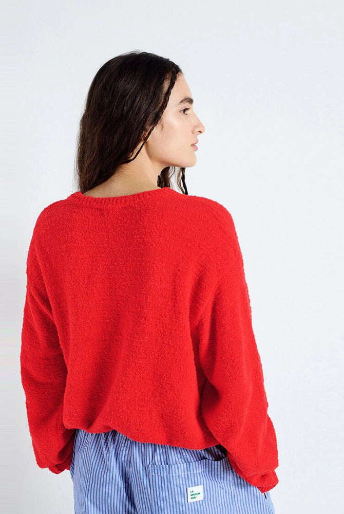Luźny sweter LIGWAY American Vintage z okrągłym dekoltem i opadającymi ramionami. Wykończony ściągaczami.