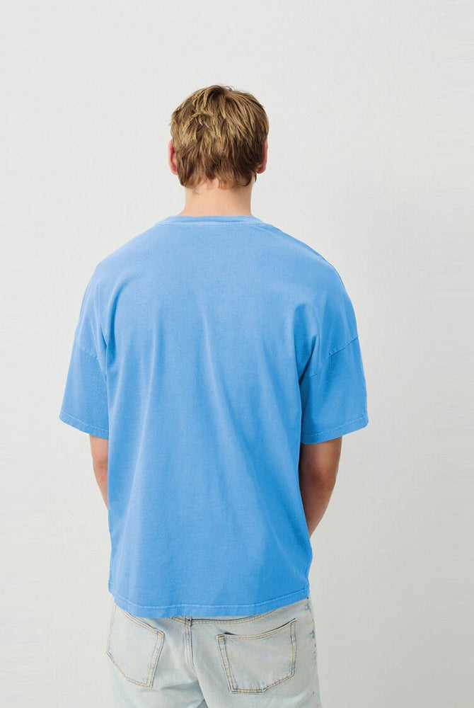 Oversizowy T-shirt unisex FIZVALLEY z krótkim rękawem. Posiada okrągły dekolt i krótki rękaw. Wykonany z grubej bawełny. 