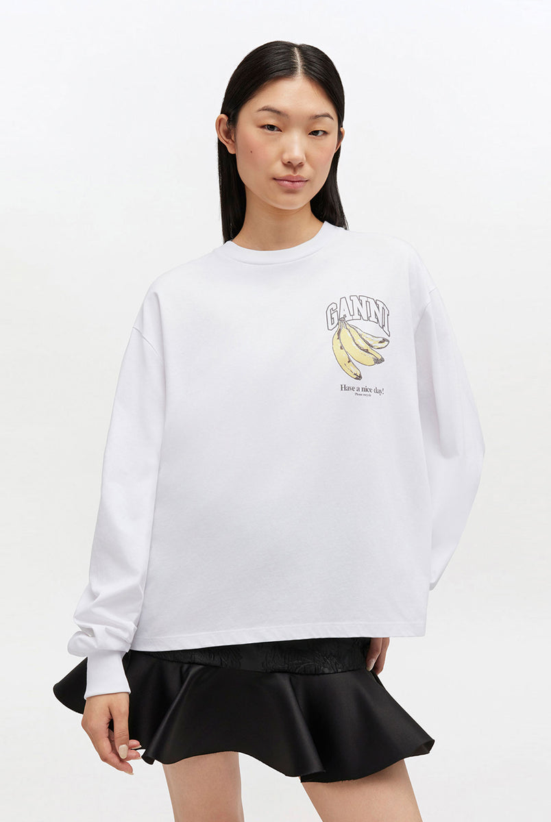 Oversizowy, biały Longsleeve Banana Print GANNI Bright White z nadrukiem banana i logo marki na lewej piersi. Koszulka ma okrągły dekolt i długie rękawy zakończone ściągaczami. Wykonana z bawełny organicznej.
-Luźny krój
-100% bawełna organiczna
-Zamów w swoim standardowym rozmiarze