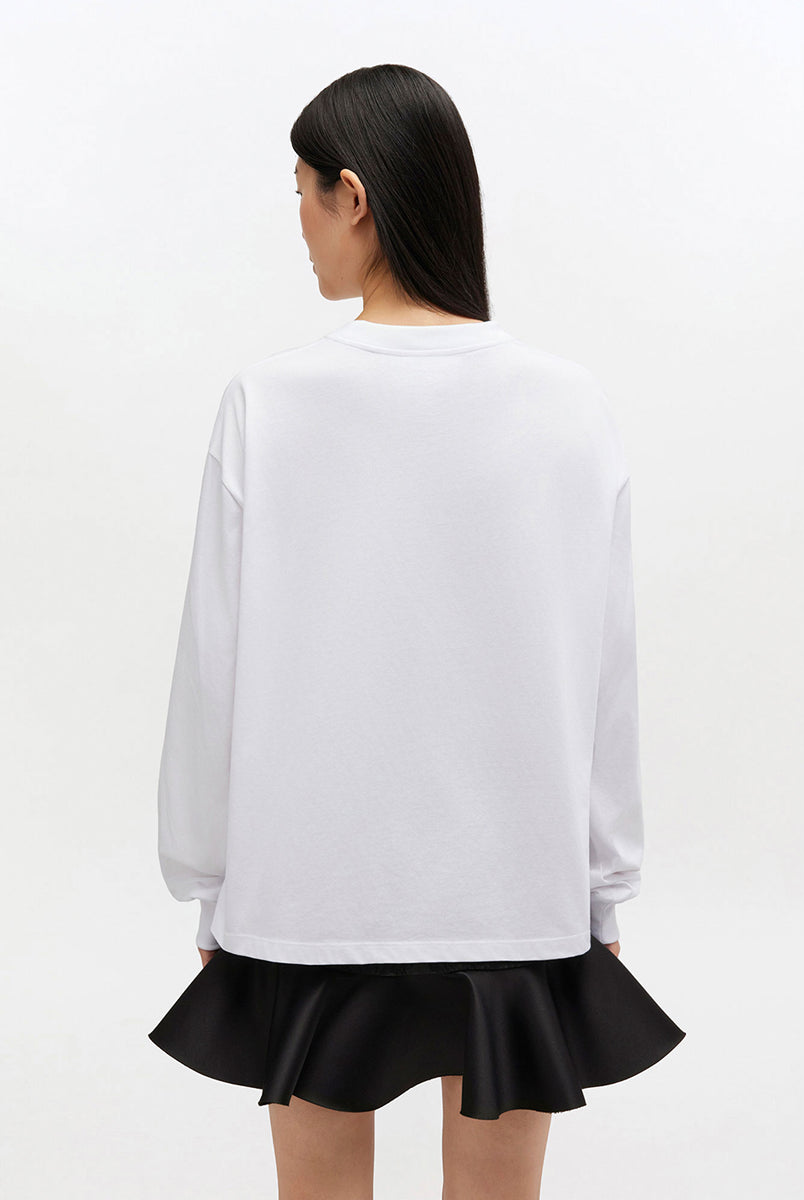 Oversizowy, biały Longsleeve Banana Print GANNI Bright White z nadrukiem banana i logo marki na lewej piersi. Koszulka ma okrągły dekolt i długie rękawy zakończone ściągaczami. Wykonana z bawełny organicznej.
-Luźny krój
-100% bawełna organiczna
-Zamów w swoim standardowym rozmiarze