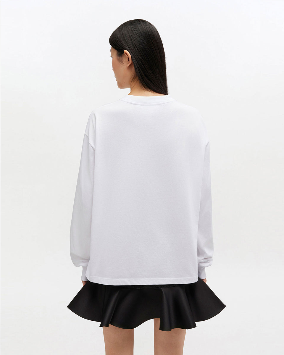 Oversizowy, biały Longsleeve Banana Print GANNI Bright White z nadrukiem banana i logo marki na lewej piersi. Koszulka ma okrągły dekolt i długie rękawy zakończone ściągaczami. Wykonana z bawełny organicznej.
-Luźny krój
-100% bawełna organiczna
-Zamów w swoim standardowym rozmiarze
