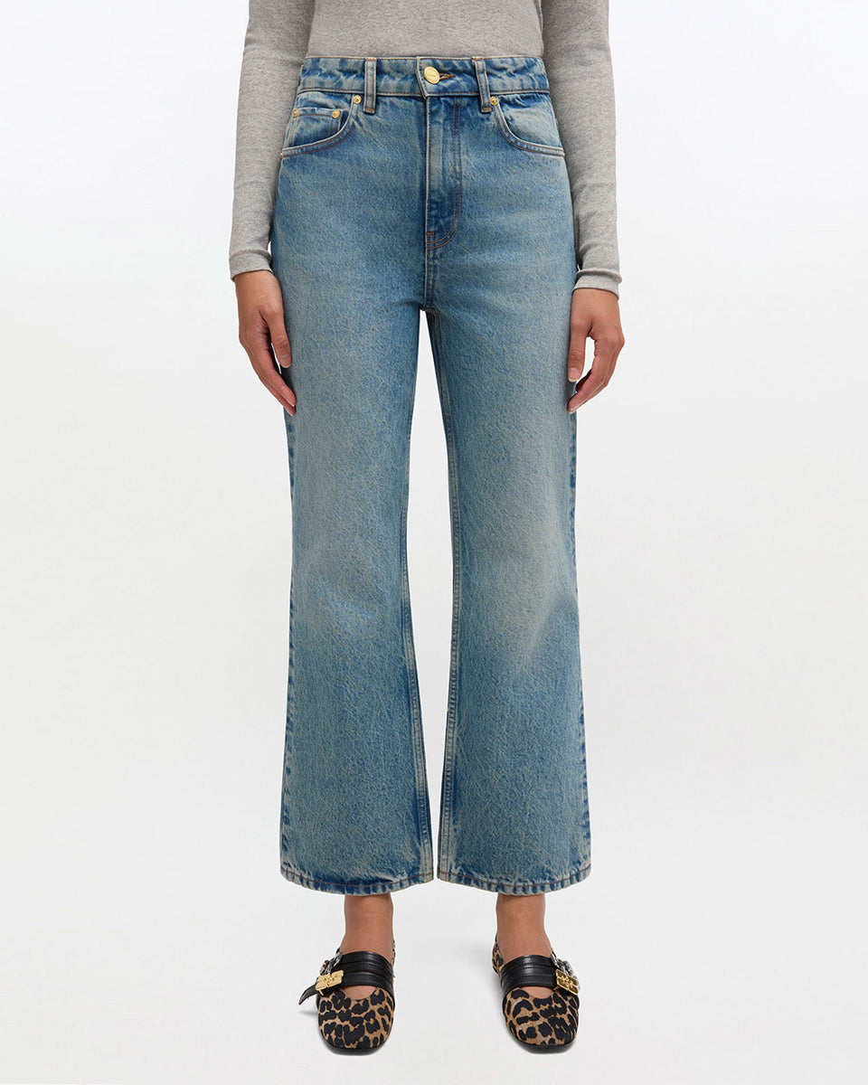 iebieskie jeansy z efektem sprania w stylu vintage Betzy GANNI Mid Blue Vintage ze średnim stanem i skróconą, lekko rozszerzaną u dołu nogawką. Dopasowane na biodrach i udach. Posiadają 5 kieszeni i niewielką naszywkę z logo GANNI na lewej, tylnej kieszeni. Wykonane z bawełny organicznej.
-Wysoki stan
-Miękka, bawełniana tkanina
-Skrócona, rozszerzana nogawka
-Zamów spodnie w swoim normalnym rozmiarze