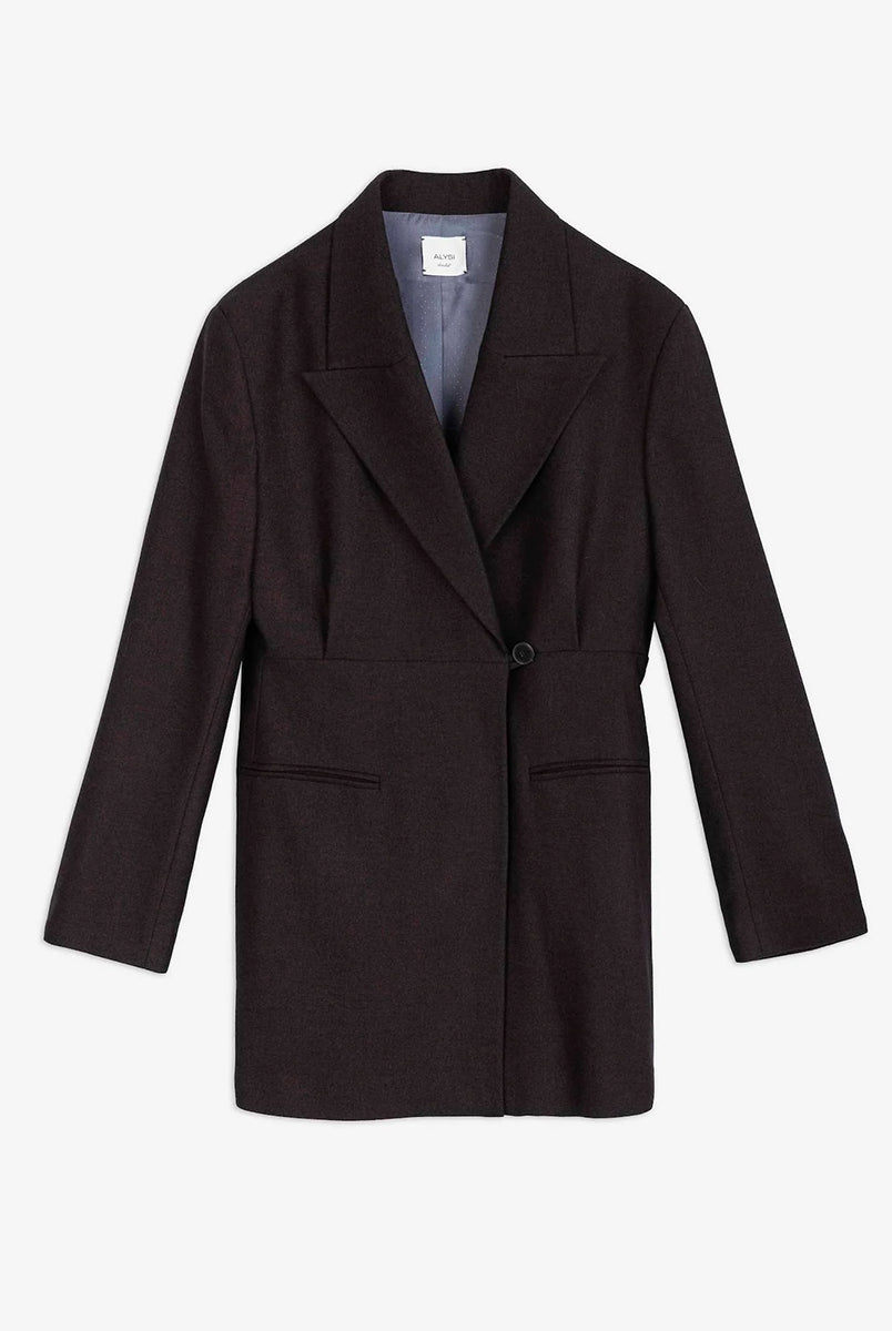 Bardzo długa, jednorzędowa marynarka Oversized Flannel Choco z wyraźnie zaznaczonymi ramionami i zwężeniem w talii. Ma asymetryczne zapięcie na guzik oraz kieszenie wpuszczane z przodu. Wykonana z mieszanki wełny i wiskozy. 