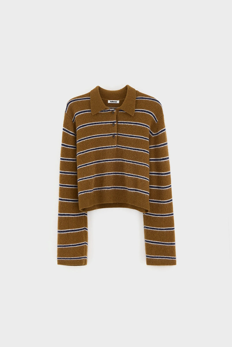 Sweter polo w paski Dussyr Polo Stripe marki Bellerose w ciepłym odcieniu camel z granatowymi i ecru pasami. Wykonany z niezwykle miękkiej przędzy z domieszką włosia jenota, o lekko puszystym wykończeniu. Ma długie rękawy i kołnierzyk typu polo z listwą guzikową. Krój regularny.
-Lekko puszysta faktura
-Kołnierzyk polo
-Zamów kardigan w swoim normalnym rozmiarze