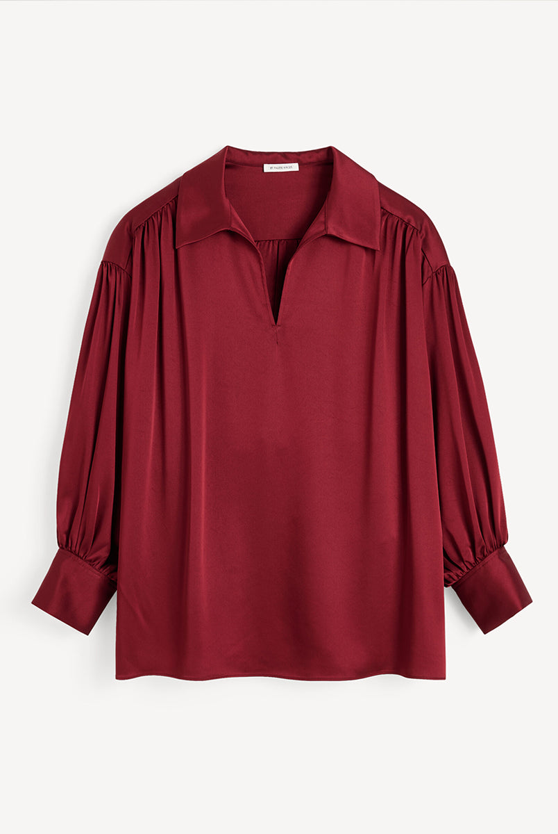 Efektowna, romantyczna bluzka Leonora Satin Cabernet By Malene Birger z kołnierzykiem, dekoltem w kształcie litery V i długimi, lekko bufiastymi rękawami z marszczeniami przy ramionach. Dodatkowo rękawy zakończone są mankietami zapinanymi na guziki. Wykonana z gładkiej, lekko połyskującej tkaniny o satynowym wykończeniu. Bluzka sprawdzi się zarówno w eleganckich, jak i bardziej codziennych stylizacjach.
-Zawyżona rozmiarówka. Zalecamy wybór mniejszego rozmiaru.