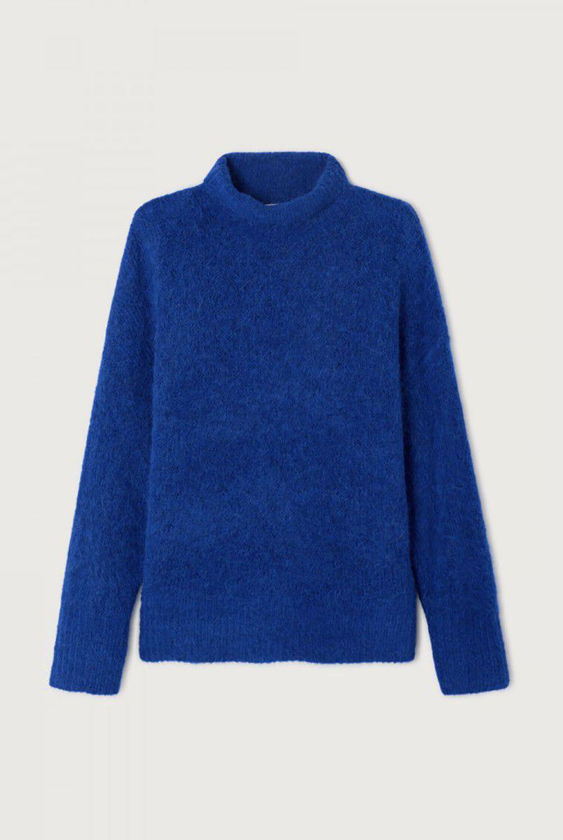 Gruby, luźny sweter Niby Blue Marl marki American Vintage z długim rękawem i golfem. Zakończony ściągaczami. Wykonany z ultraciepłej, miękkiej dzianiny z alpaką. Noś go z jeansami lub spódnicą, aby uzyskać swobodny look. 
