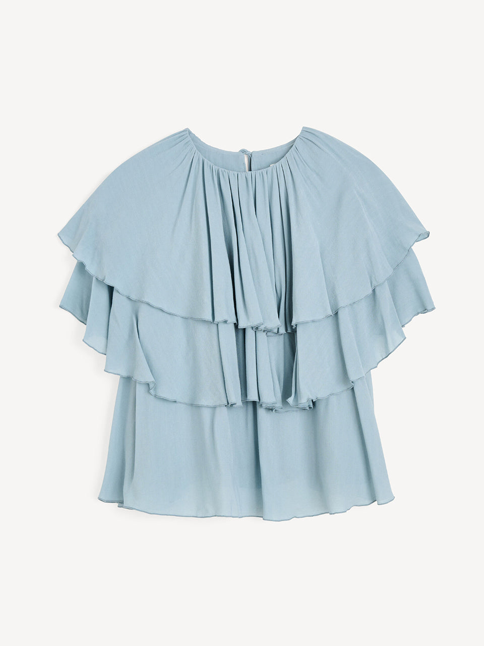 Luźny, błękitny top Nina Arona Blue By Malene Birger z okrągłym dekoltem i wiązaniem z tyłu. Składa się z kilku, półprzezroczystych warstw. Pierwsza falbana opada na ramiona, tworząc efekt 'rękawa skrzydełka'. Wykonany z wiskozy.
-Luźny, swobodny fason
-Bez rękawów
-Zamów w swoim standardowym rozmiarze 