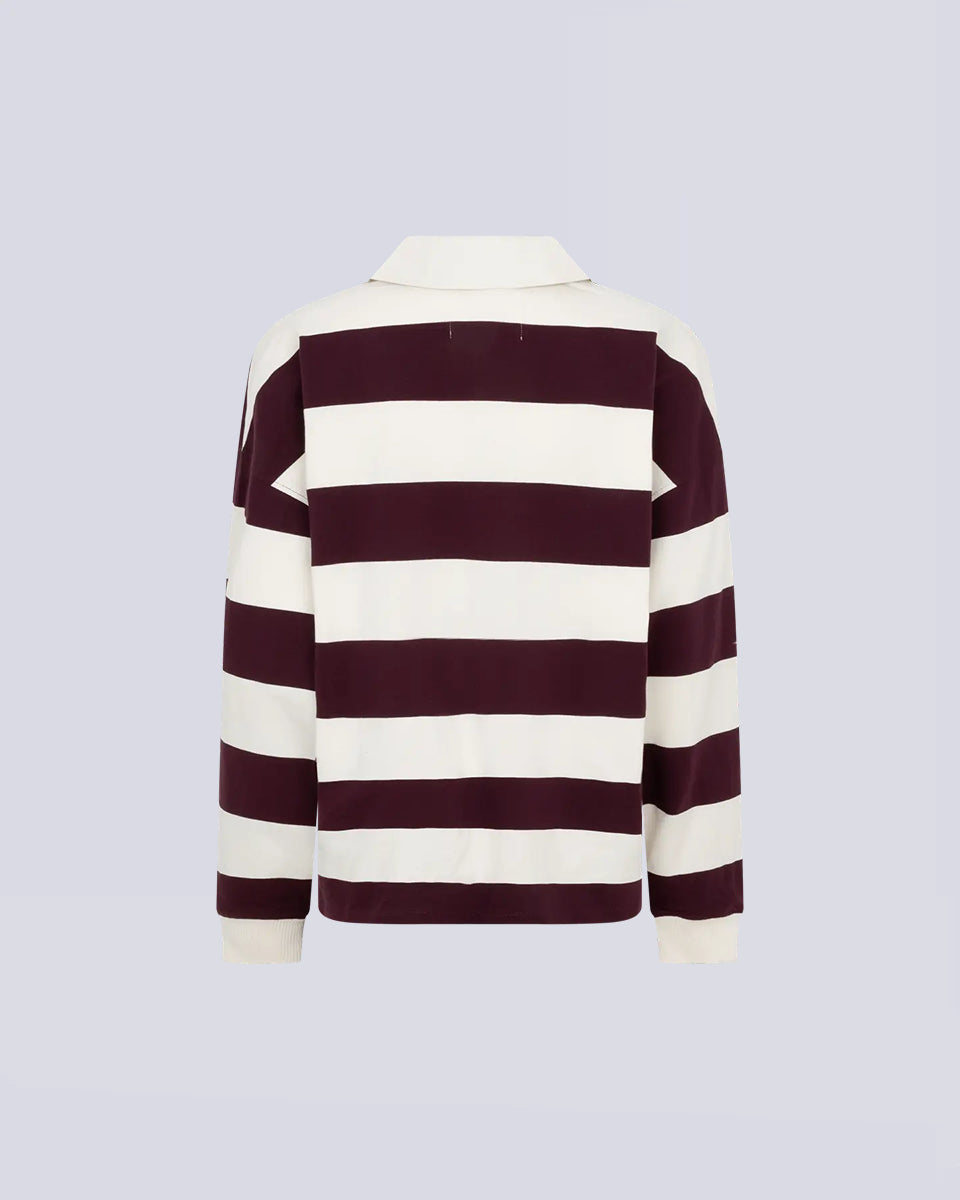 Luźny longsleeve z długim rękawem Paul Stripes Love Stories o ponadczasowym wzorze w kremowo-bordowe paski. Posiada kołnierzyk zapinany na guziki. Nad prawą piersią znajduje się niewielkie logo marki. Wykonany z lekkiej bawełny, zapewnia komfort noszenia przez cały dzień. Jest wszechstronnym elementem garderoby, który łatwo zestawić zarówno z codziennymi, jak i bardziej eleganckimi stylizacjami.