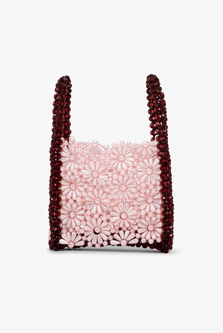 Mała, urocza torebka Bouquet Bead SUI AVA z koralików ułożonych w kwiatowy wzór. Torebka ma prostokątny kształt i dwie, krótkie rączki do wygodnego trzymania w dłoni.