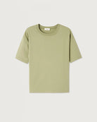 Luźny, oversizowy, prosty t-shirt FIZVALLEY American Vintage z krótkim, szerokim rękawem i okrągłym dekoltem. Wykonany z grubej, mięsistej bawełny. 