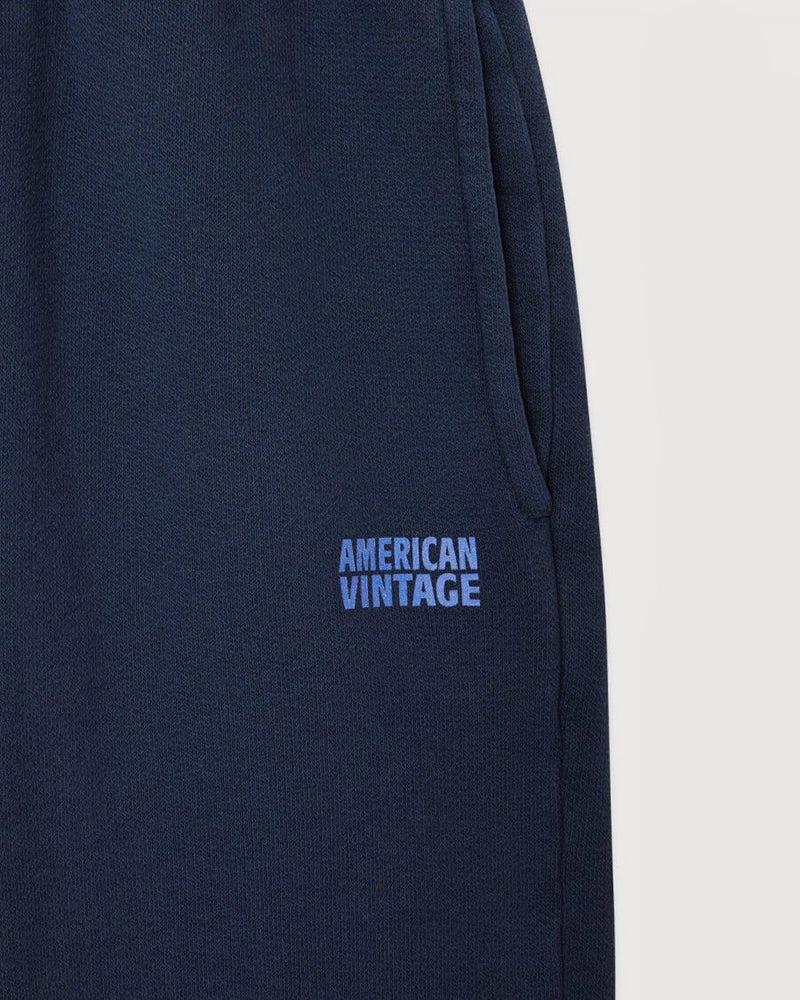 Granatowe spodnie dresowe IZUBIRD American Vintage z wysokim stanem i luźną, zwężaną u dołu nogawką