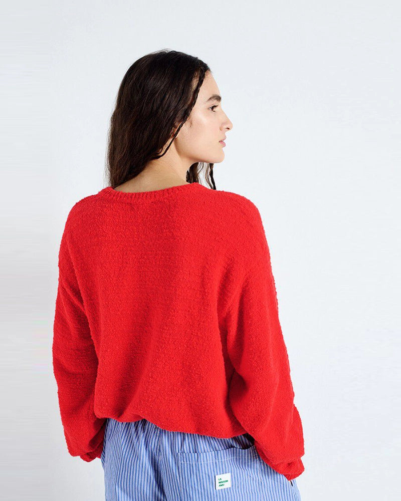 Luźny sweter LIGWAY American Vintage z okrągłym dekoltem i opadającymi ramionami. Wykończony ściągaczami.