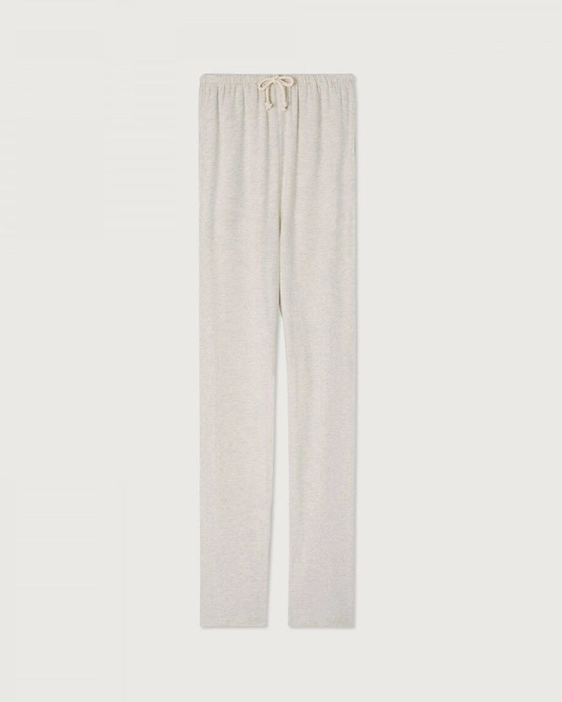 Luźne, bawełniane spodnie dresowe YPAWOOD American Vintage z wysokim stanem i szeroką, długą, prostą nogawką. Wiązane i elastyczne w talii. Wykonane z bardzo miękkiej, miłej w dotyku i komfortowej tkaniny.&nbsp;