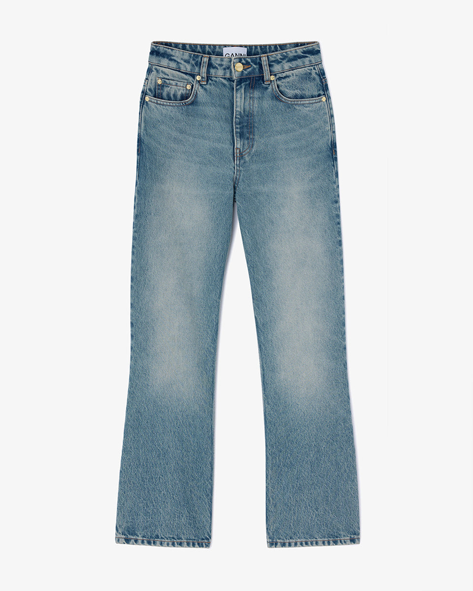 iebieskie jeansy z efektem sprania w stylu vintage Betzy GANNI Mid Blue Vintage ze średnim stanem i skróconą, lekko rozszerzaną u dołu nogawką. Dopasowane na biodrach i udach. Posiadają 5 kieszeni i niewielką naszywkę z logo GANNI na lewej, tylnej kieszeni. Wykonane z bawełny organicznej.

-Wysoki stan

-Miękka, bawełniana tkanina

-Skrócona, rozszerzana nogawka

-Zamów spodnie w swoim normalnym rozmiarze