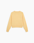 Jasny, pastelowy sweter Breeze TNS Sunlight o klasycznym, prostym kroju z okrągłym dekoltem wykończonym delikatnym ściągaczem. Posiada długie, nieco luźniejsze rękawy, które przy nadgarstkach przechodzą w szerokie ściągacze. Dół ma nieco krótszą długość, sięgającą do okolic pasa, co sprawia, że świetnie komponuje się z ciemnymi, szerokimi spodniami z wysokim stanem. Wykonany z mieszanki wełny merino i kaszmiru.

-Okrągły dekolt

-Wykończony ściągaczami&nbsp;

-Miękka tkanina z wełną merino i kaszmirem