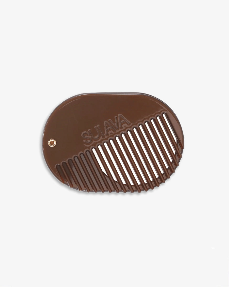 Kompaktowy grzebień do włosów SA ICON Mirror/Comb SUI AVA z lusterkiem. Produkt idealnie nadaje się do noszenia w torebce, umożliwiając szybkie poprawki wyglądu w ciągu dnia.

Akcesoria do włosów nie podlegają zwrotowi ani wymianie ze względów higienicznych.&nbsp;