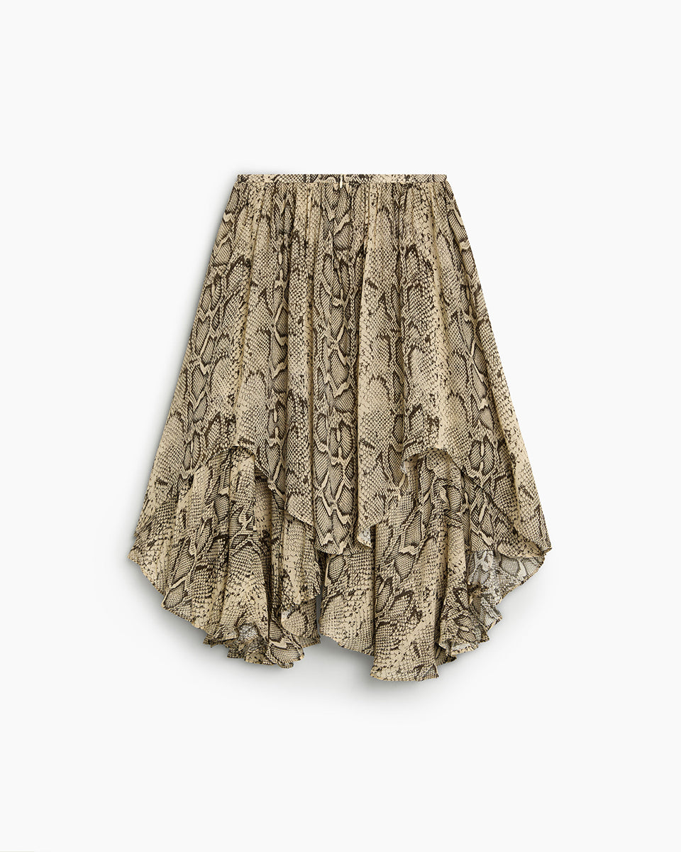 Efektowna, midi spódnica Isley TNS Snake Print wyróżnia się wężowym printem, który łączy w sobie odcienie beżu, brązu, szarości i czerni. Posiada luźny, zwiewny krój z efektownymi kaskadowymi falbanami i asymetrycznym dołem, co nadaje jej dynamicznej objętości oraz lekkości w ruchu. Model ten ma wygodny, elastyczny pas, który subtelnie marszczy materiał u góry. Dzięki warstwowej budowie spódnica pięknie faluje się i stanowi wyrazisty element każdej stylizacji.

-Długość midi

-Asymetryczny krój

-Falbany