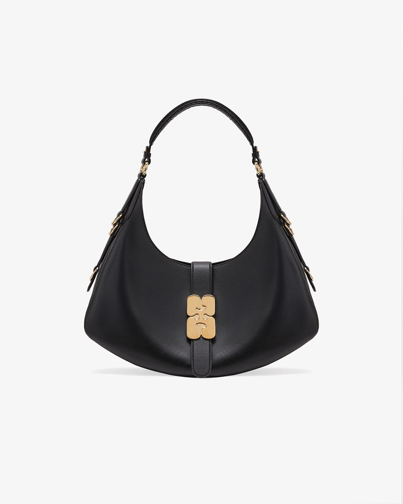 Ponadczasowa, czarna torebka Kat Small 6998 GANNI black w stylu souffle o zaokrąglonym kształcie, z paskiem na ramię i detalami w kształcie D-ringów z boku. Posiada zapięcie z przodu, z charakterystycznym złotym detalem GANNI Butterfly. Ma jedną, główną kieszeń otwartą. Wykonana z opatentowanego przez markę, ekologicznego materiału bedącego połączeniem skóry z recyclingu oraz syntetycznych włókien. Uniwersalny rozmiar torebki sprawia, że będzie idealna zarówno na codzień, jak i na eleganckie okazje.&nbsp;