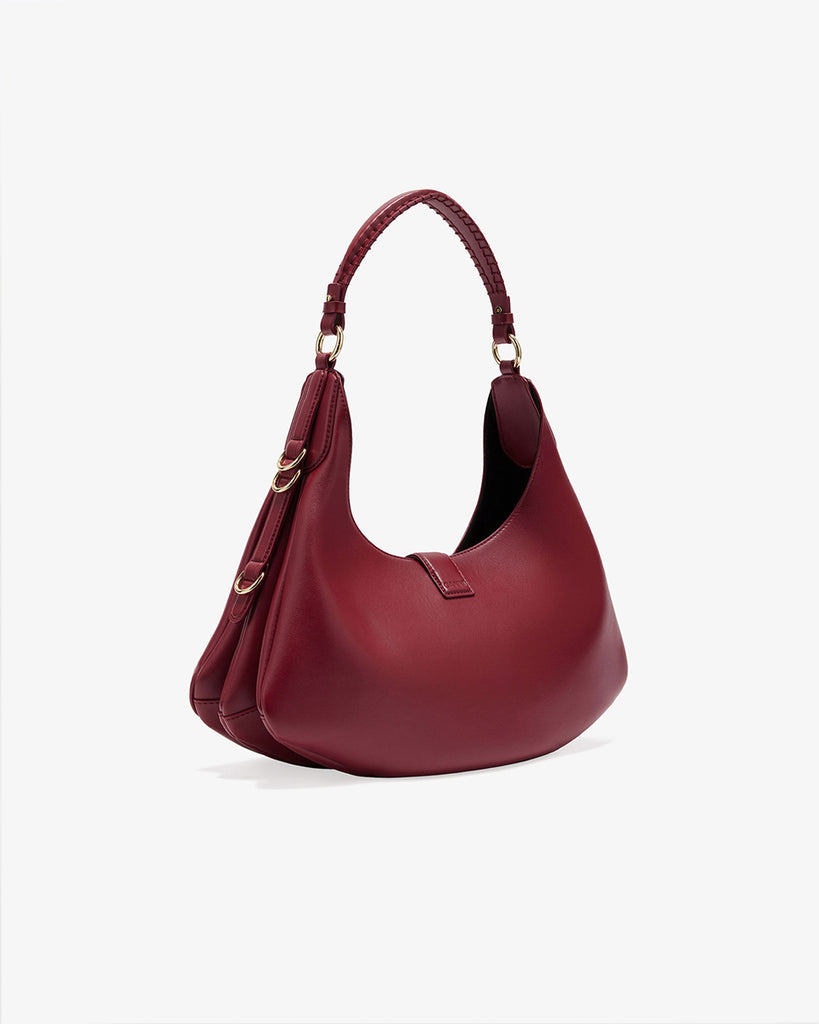 Ponadczasowa, czerwona torebka Kat Small 7077 GANNI Red Dahlia w stylu souffle o zaokrąglonym kształcie, z paskiem na ramię i detalami w kształcie D-ringów z boku. Posiada zapięcie z przodu, z charakterystycznym złotym detalem GANNI Butterfly. Ma jedną, główną kieszeń otwartą. Wykonana z opatentowanego przez markę, ekologicznego materiału bedącego połączeniem skóry z recyclingu oraz syntetycznych włókien. Uniwersalny rozmiar torebki sprawia, że będzie idealna zarówno na codzień, jak i na eleganckie okazje.&