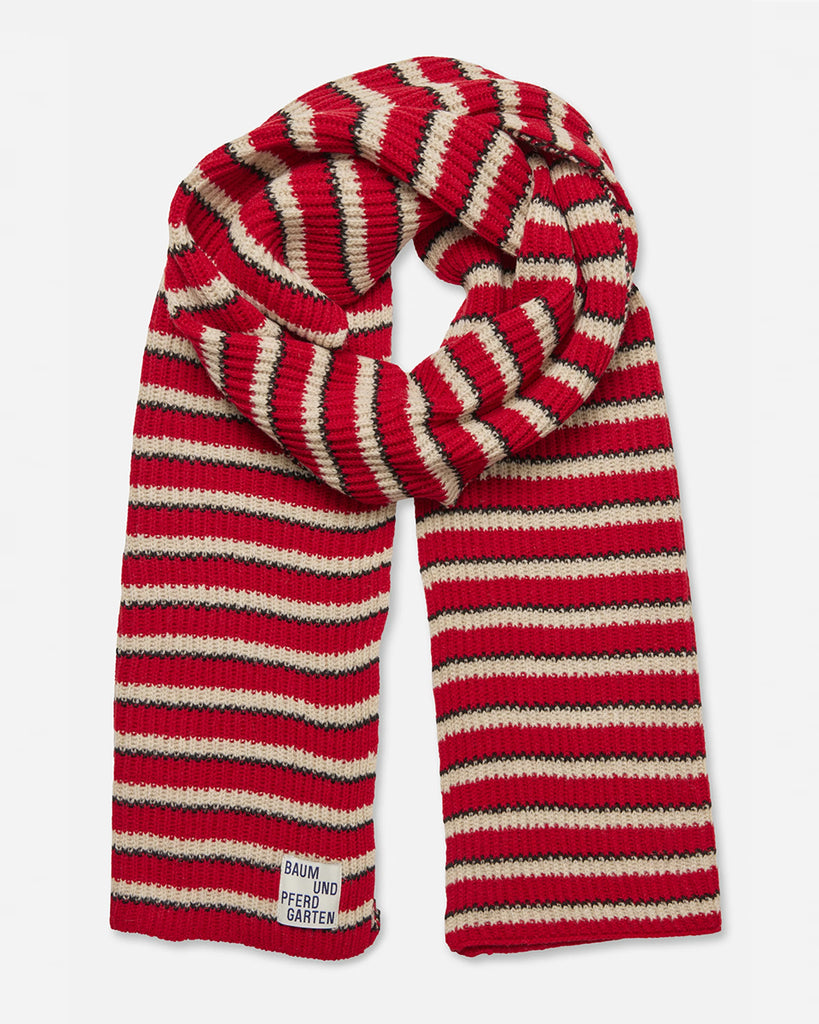 Ciepły szalik Leora Red Strip w paski o przytulnej, prążkowanej fakturze, który zapewnia stylowy wygląd. Wykonany z miękkiej dzianiny z wełną. Połącz go z pasującą czapką Leia, aby stworzyć idealny zestaw.&nbsp;