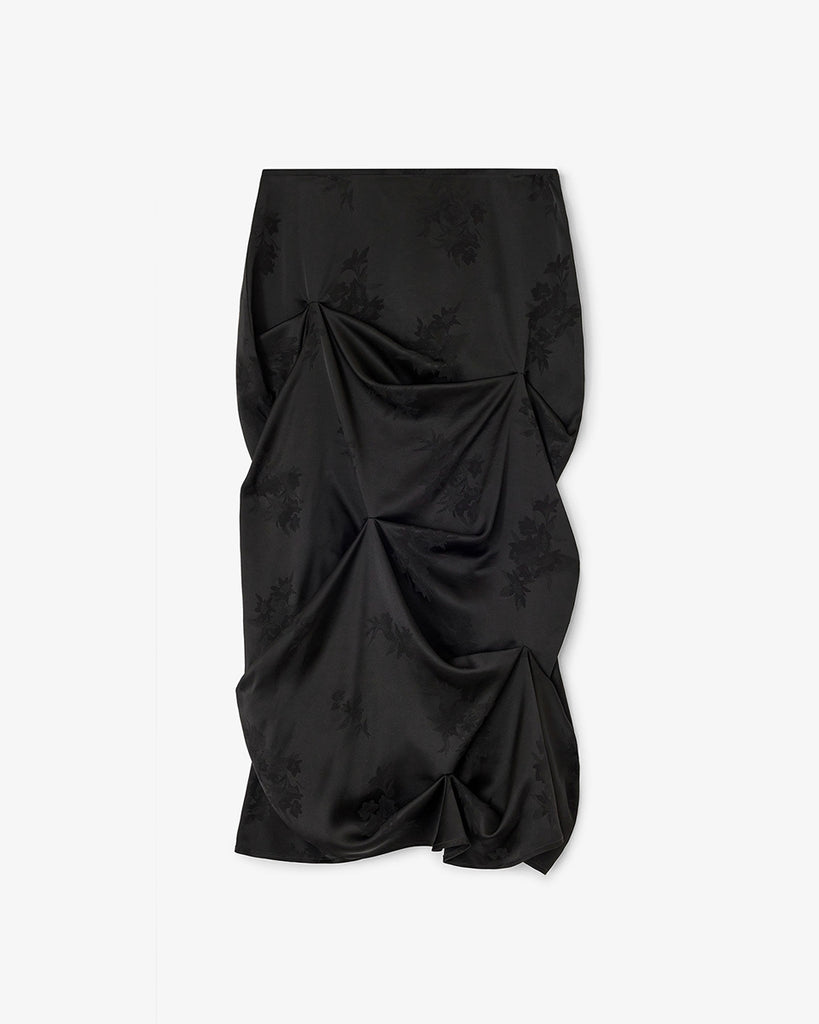 Luźna, drapowana spódnica 0997 Ganni Satin Black o satynowym wyglądzie, zdobiona kwiatowymi wzorami. Ma długość do połowy łydki. Zapinana z boku na zamek błyskawiczny. Idealna do luźnego topu i butów na obcasie typu kowbojki.&nbsp;
