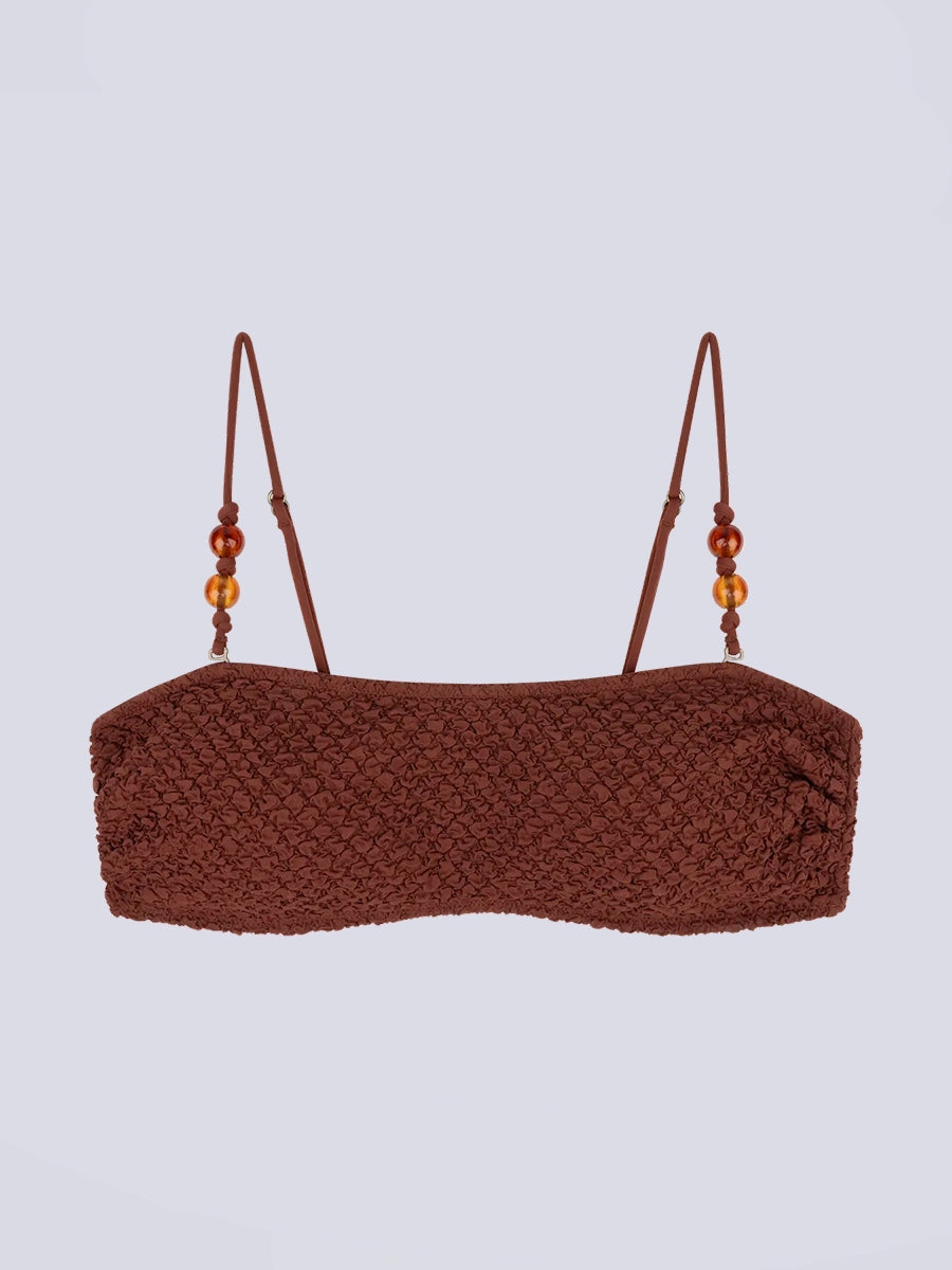 Góra od bikini w stylu bandażowym Bondi Love Stories z utwardzającymi wkładkami. Posiada cienkie, odpinane ramiączka z koralikami. Wykonana z tkaniny z fakturą.