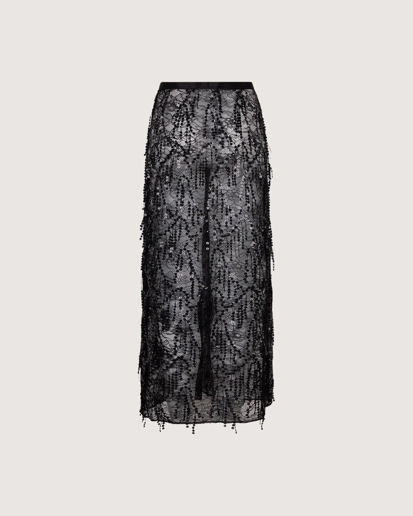 Czarna, transparentna, koronkowa spódnica midi Mia Love Stories z wysokim stanem i elastyczną talią. Posiada długość przed kostki. Idealna do luźnego swetra lub oversizowej koszuli.