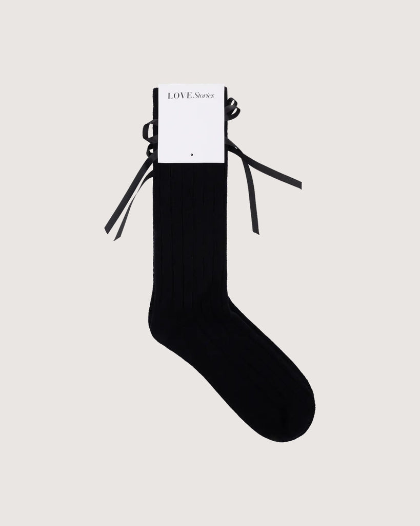 Długie, czarne skarpetki z kaszmirem Love Stories z uroczymi kokardkami. Wykonane z dzianiny z prążkowaną fakturą.