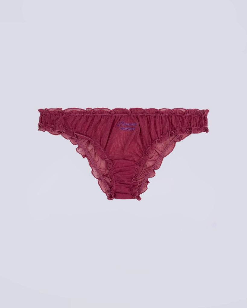 Majtki Lola Love Stories Multi Color z falbanką w zestawie trzech sztuk w kolorze fioletowym, liliowym i zielonym. Majtki wykonane z cienkiej, siateczkowej, częściowo transparentnej tkaniny. Posiadają niski stan na gumce i urocze napisy wyszywane z przodu.&nbsp;

Majtki nie podlegają zwrotom ani wymianom ze względów higienicznych.