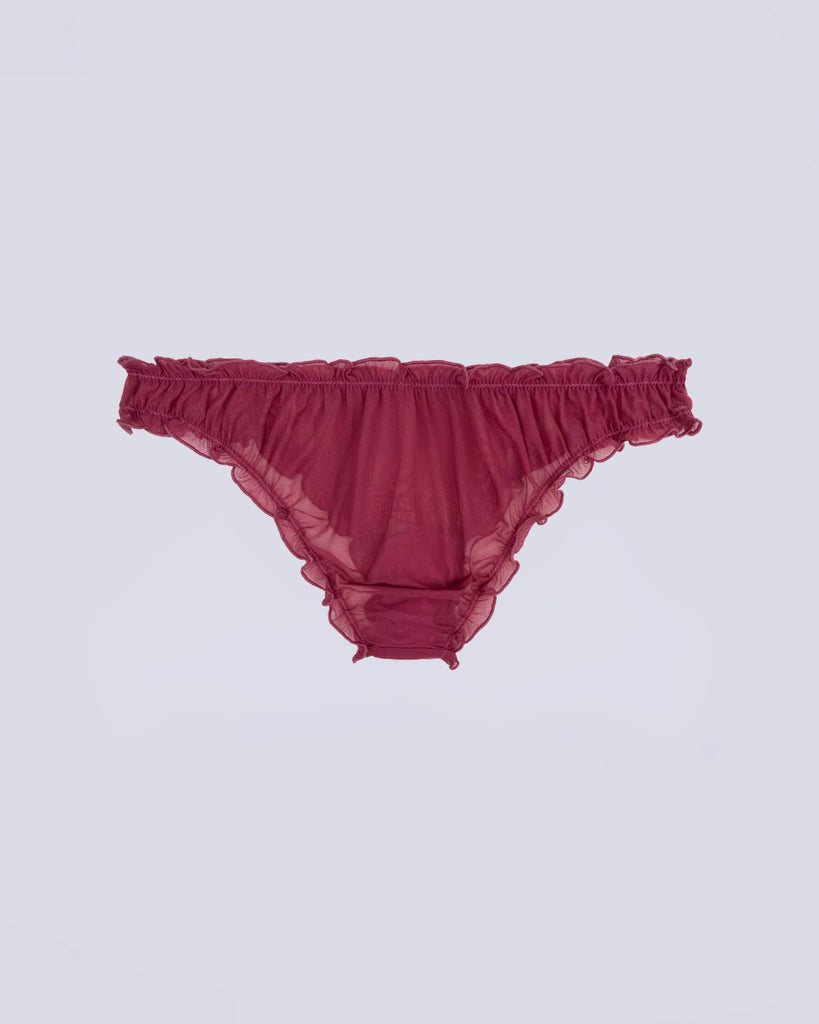 Majtki Lola Love Stories Multi Color z falbanką w zestawie trzech sztuk w kolorze fioletowym, liliowym i zielonym. Majtki wykonane z cienkiej, siateczkowej, częściowo transparentnej tkaniny. Posiadają niski stan na gumce i urocze napisy wyszywane z przodu.&nbsp;

Majtki nie podlegają zwrotom ani wymianom ze względów higienicznych.