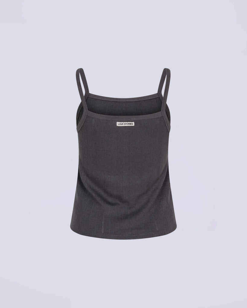 Top na ramiączkach Mary Love Stories Dark Grey w kolorze ciemnoszarym. Top ma luźny fason i prosty dekolt. Wykonany z bardzo miękkiej tkaniny z delikatną fakturą. 