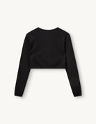 Czarny, dopasowany top Madison Black marki The Garment o minimalistycznym, wyrazistym kroju. Ma okrągły, zabudowany dekolt i długie rękawy. U dołu materiał jest zebrany i związany w supeł, co tworzy delikatne marszczenie i skróconą długość odsłaniającą brzuch. Wykonany z miękkiej, przylegającej do ciała tkaniny.

-Dopasowany krój

-Skrócona długość&nbsp;

-Zamów top w swoim standardowym rozmiarze
