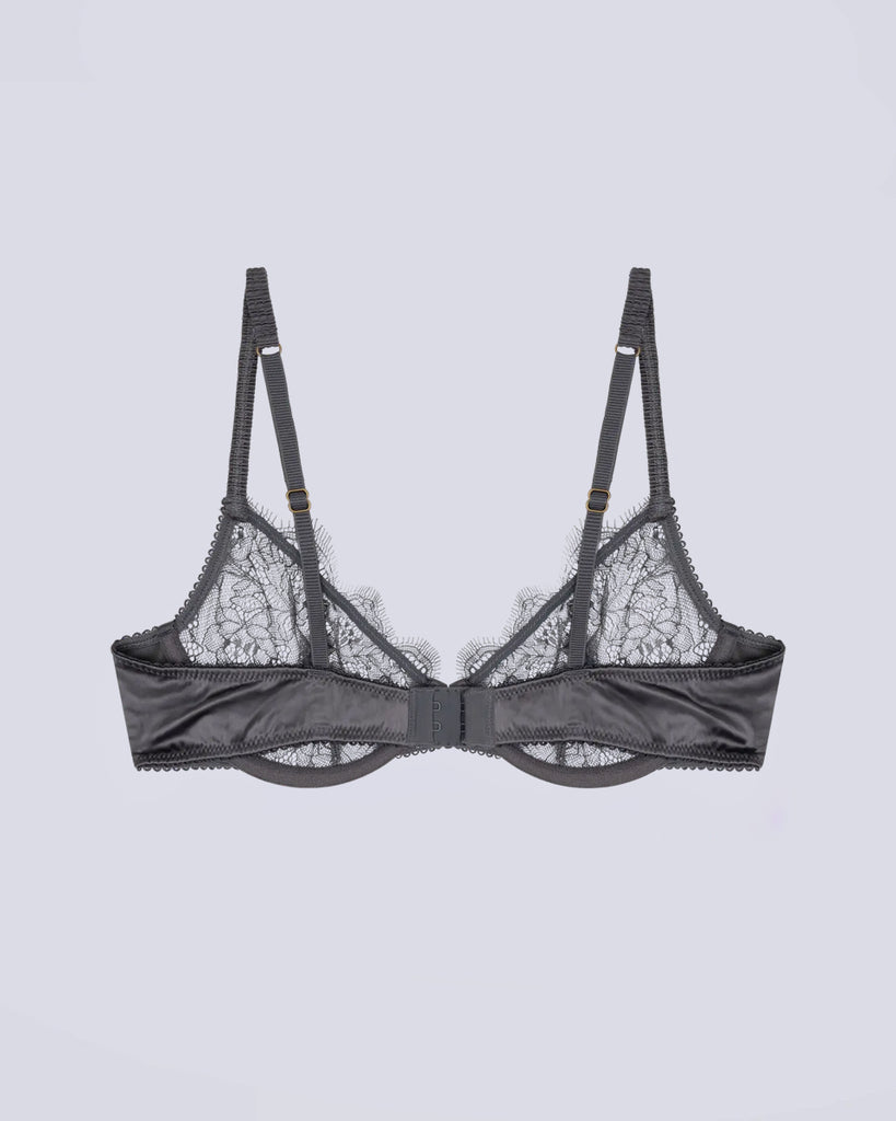 Koronkowy, ciemnoszary stanik Romeo Love Stories z fiszbinami i miękkimi miseczkami. Biustonosz ma regulowane ramiączka i zapinany jest za pomocą haftek.