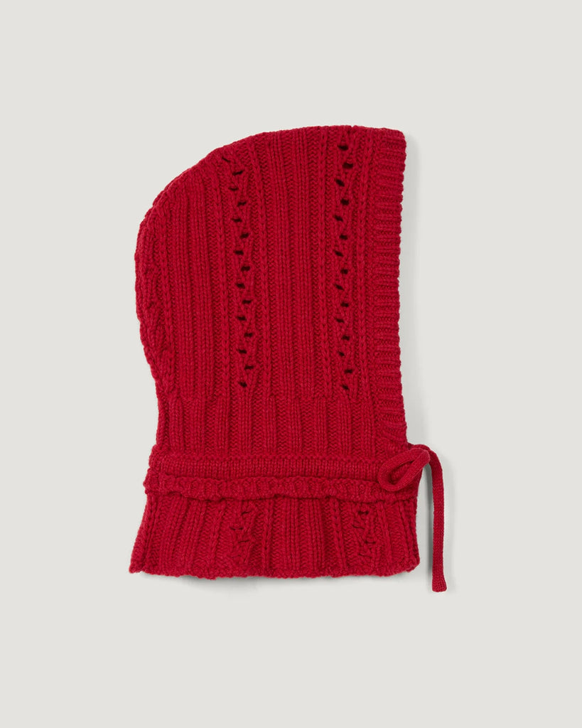 Czerwona, dzianinowa balaclava Amine Rouje. Wykonana z ciepłej dzianiny z wełną. Wiązana pod szyją na kokardkę.