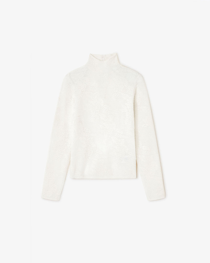 Lekko prześwitujący golf 2643 GANNI Egret z wysokim kołnierzykiem i długimi rękawami z kwiatowym printem. Posiada zapięcie na ozdobne guziczki z tyłu. Idealny do spódnicy lub luźnych spodni. Wykonany z tkaniny z alpaką i wełną.
