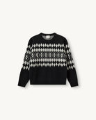 Luźny, wełniany sweter Faroe The Garment w geometryczny, kontrastowy wzór. Posiada okrągły dekolt, opadające ramiona i długie rękawy. Wykończony ściągaczami. Sweter ma prosty krój i długość za biodra. Wykonany z grubej i miękkiej, wełnianej dzianiny z kaszmirem
