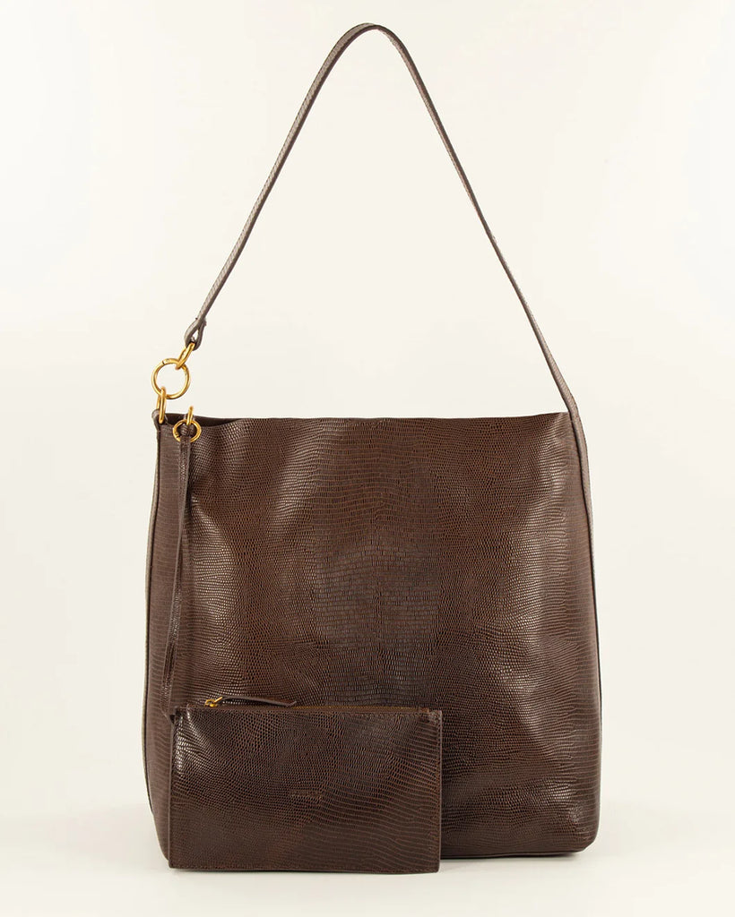 Duża torba typu tote Vita Mia Browny Lezard z nadrukiem imitującym skórę jaszczurki. Zapięcie na zatrzask. Posiada dużą komorę centralną z odpinaną kieszonką, zapinaną na zamek. Z tyłu torby wytłoczone jest logo marki.&nbsp;