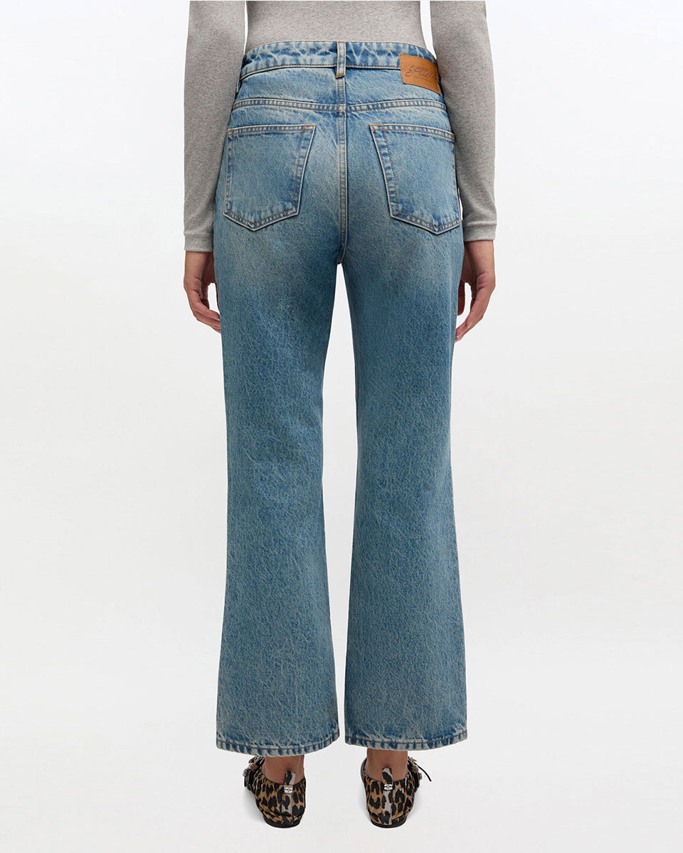 iebieskie jeansy z efektem sprania w stylu vintage Betzy GANNI Mid Blue Vintage ze średnim stanem i skróconą, lekko rozszerzaną u dołu nogawką. Dopasowane na biodrach i udach. Posiadają 5 kieszeni i niewielką naszywkę z logo GANNI na lewej, tylnej kieszeni. Wykonane z bawełny organicznej.

-Wysoki stan

-Miękka, bawełniana tkanina

-Skrócona, rozszerzana nogawka

-Zamów spodnie w swoim normalnym rozmiarze